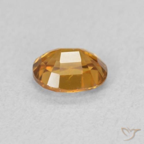 Zircon Orange brunâtre naturelle ovale, 0.65 ct, VVS-VS