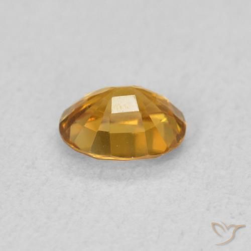 Zircon Doré foncé naturelle ovale, 0.57 ct, VVS