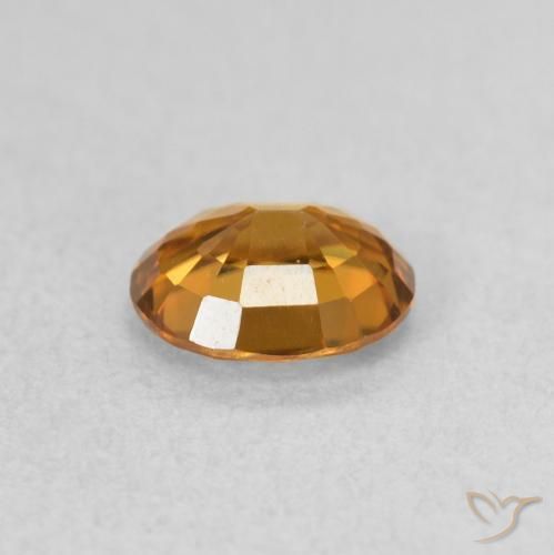 Zircon Orange brunâtre naturelle ovale, 0.94 ct, VVS