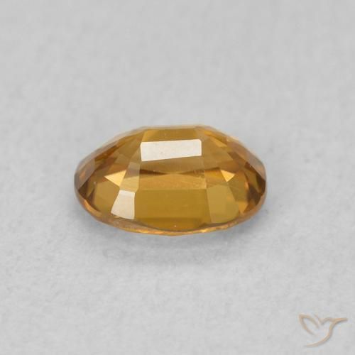Zircon Orange doré naturelle ovale, 0.62 ct, VVS