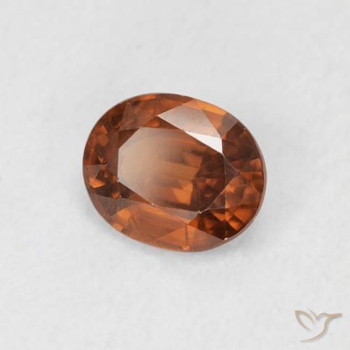 Zircon Orange rougeâtre naturelle ovale, 0.94 ct, VS
