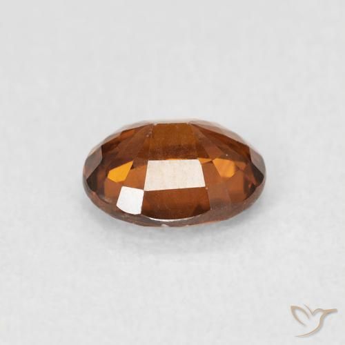Zircon Orange rougeâtre naturelle ovale, 0.94 ct, VS