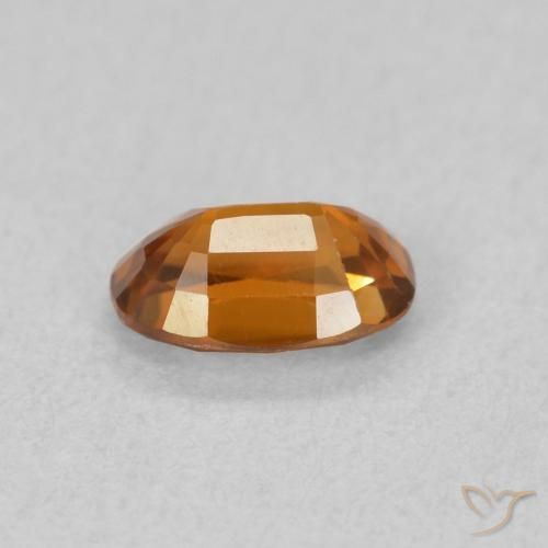 Zircon Orange foncé naturelle ovale, 0.77 ct, VVS-VS