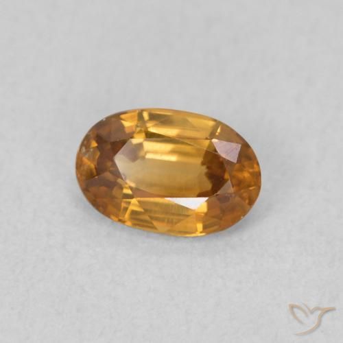 Zircon Orange rouille naturelle ovale, 0.70 ct, VVS-VS