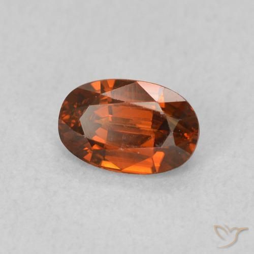 Zircon Orange rougeâtre naturelle ovale, 0.82 ct, VVS-VS