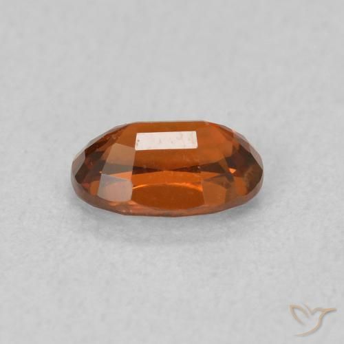 Zircon Orange rougeâtre naturelle ovale, 0.82 ct, VVS-VS
