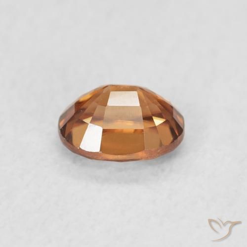 Zircon Orange foncé naturelle ovale, 0.63 ct, VVS