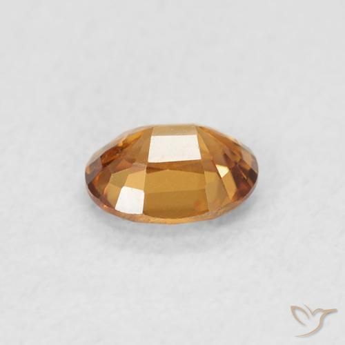 Zircon Orange foncé naturelle ovale, 0.61 ct, VVS