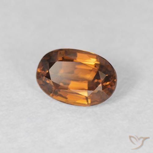 Zircon Orange brunâtre naturelle ovale, 0.86 ct, VVS