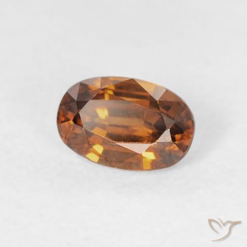 Zircon Orange brunâtre naturelle ovale, 0.81 ct, VVS