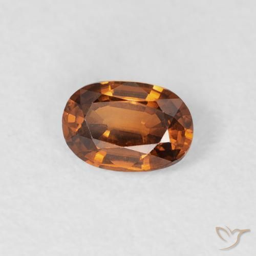 Zircon Orange foncé naturelle ovale, 0.64 ct, VVS
