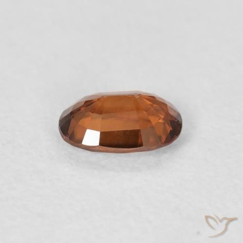 Zircon Orange foncé naturelle ovale, 0.64 ct, VVS