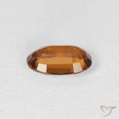 Zircon Orange foncé naturelle ovale, 0.70 ct, VS