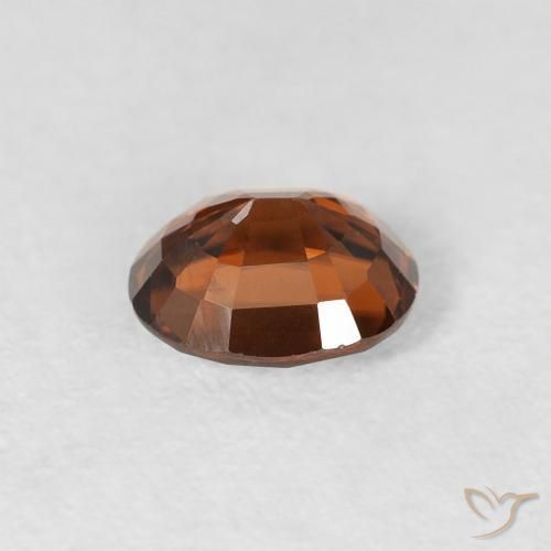 Zircon Orange brunâtre foncé naturelle ovale, 0.99 ct, VS