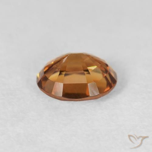 Zircon Orange rouille naturelle ovale, 1.03 ct, VS