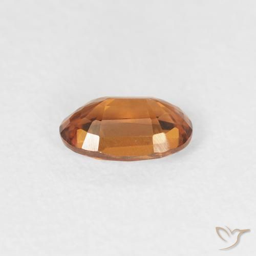 Zircon Orange foncé naturelle ovale, 0.64 ct, VVS