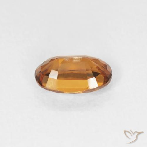 Zircon Orange foncé naturelle ovale, 0.68 ct, VVS