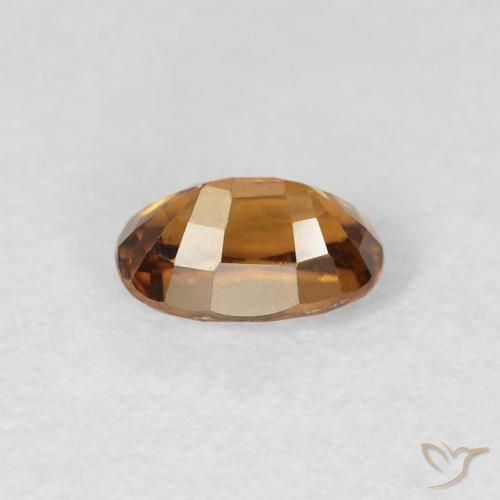Zircon Orange brun naturelle ovale, 0.84 ct, VS