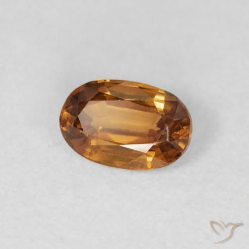 Zircon Orange brunâtre naturelle ovale, 0.70 ct, VVS-VS