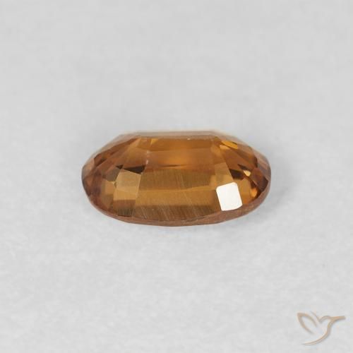 Zircon Orange brunâtre naturelle ovale, 0.70 ct, VVS-VS