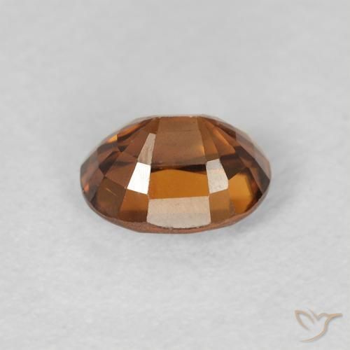 Zircon Orange brunâtre foncé naturelle ovale, 1.12 ct, VVS-VS